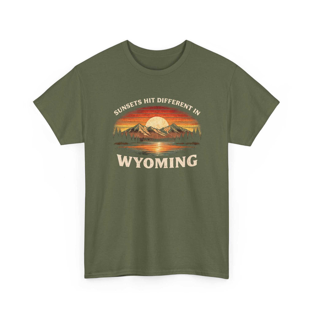 Wyoming Sunset Graphic T-Shirt by Big Sky Ranch Co. featuring mountain and sunset design with "Sunsets Hit Different in Wyoming" text.