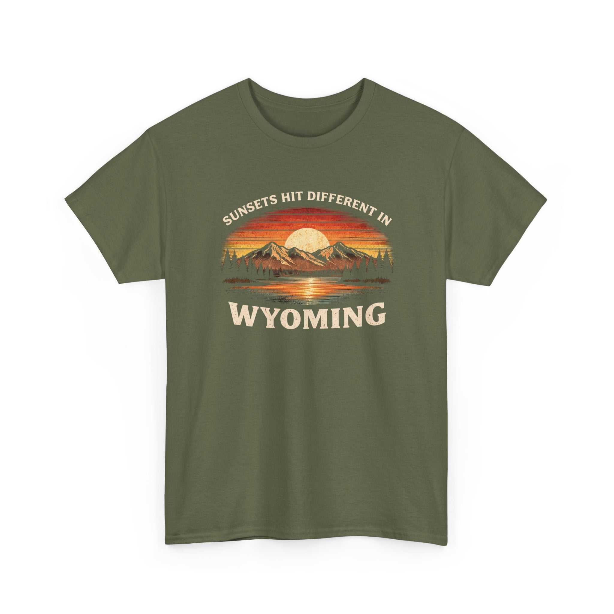 Wyoming Sunset Graphic T-Shirt by Big Sky Ranch Co. featuring mountain and sunset design with "Sunsets Hit Different in Wyoming" text.