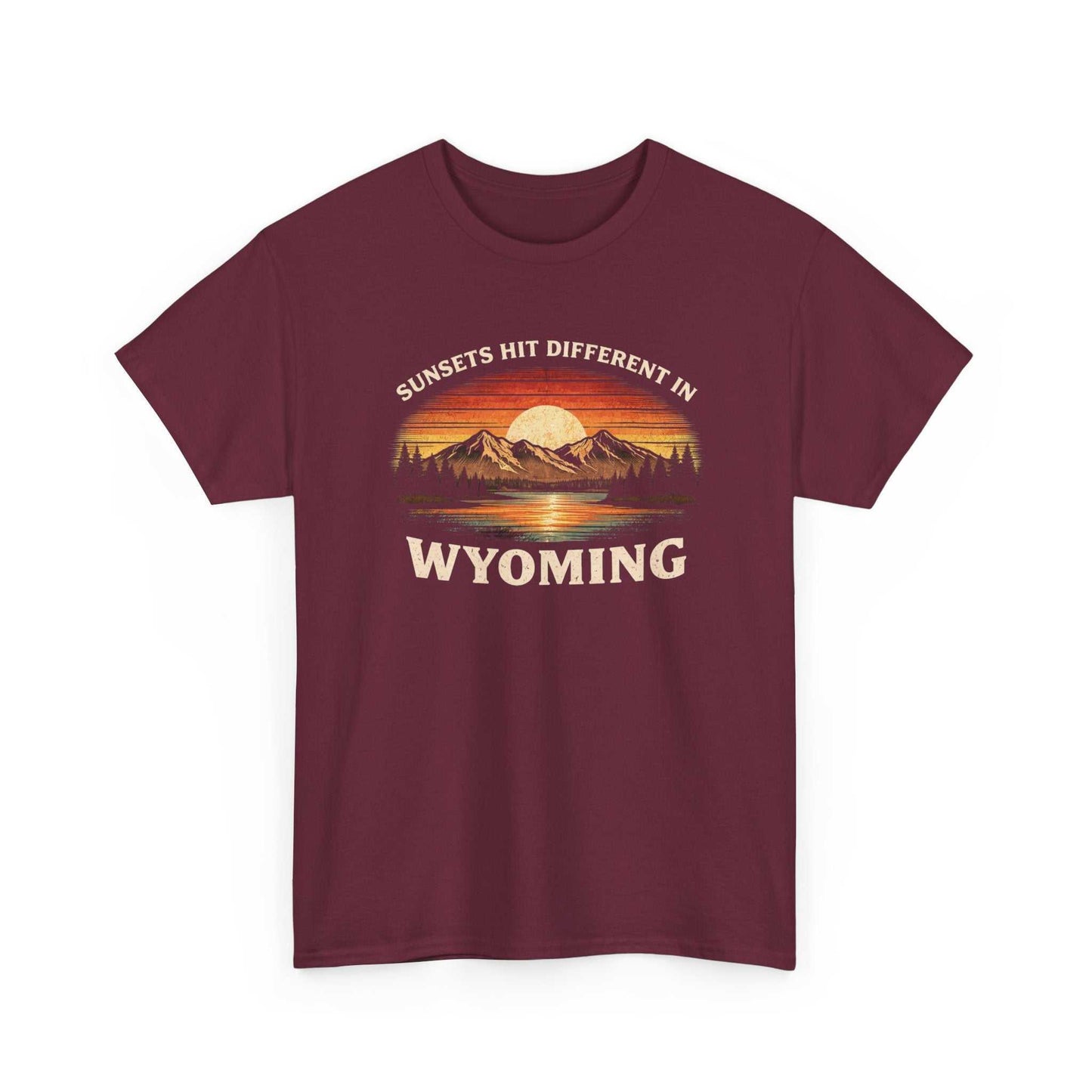 Big Sky Ranch Co. Wyoming Sunset graphic T-shirt featuring mountain and sunset design with "Sunsets Hit Different in Wyoming" text.