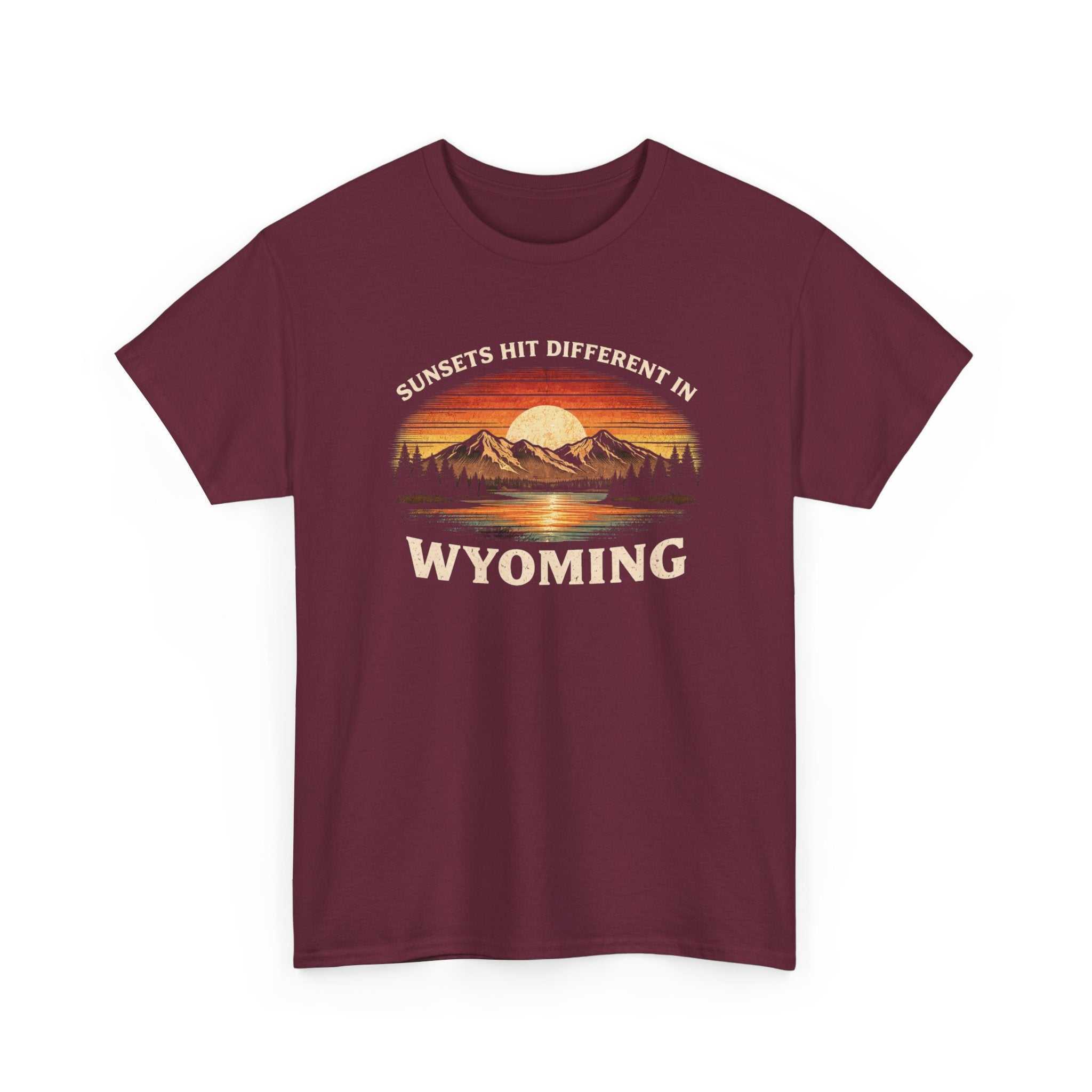 Big Sky Ranch Co. Wyoming Sunset graphic T-shirt featuring mountain and sunset design with "Sunsets Hit Different in Wyoming" text.