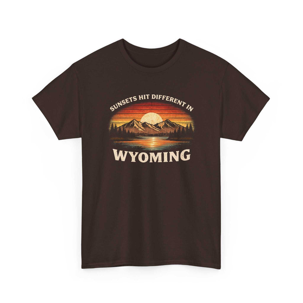 Big Sky Ranch Co. Wyoming Sunset graphic T-shirt featuring mountain and sunset design with "Sunsets Hit Different in Wyoming" text.