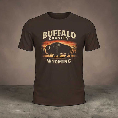 Buffalo Country Wyoming T-shirt featuring a rugged bison silhouette with open plains, mountain accents, and a distressed vintage Western outdoor style