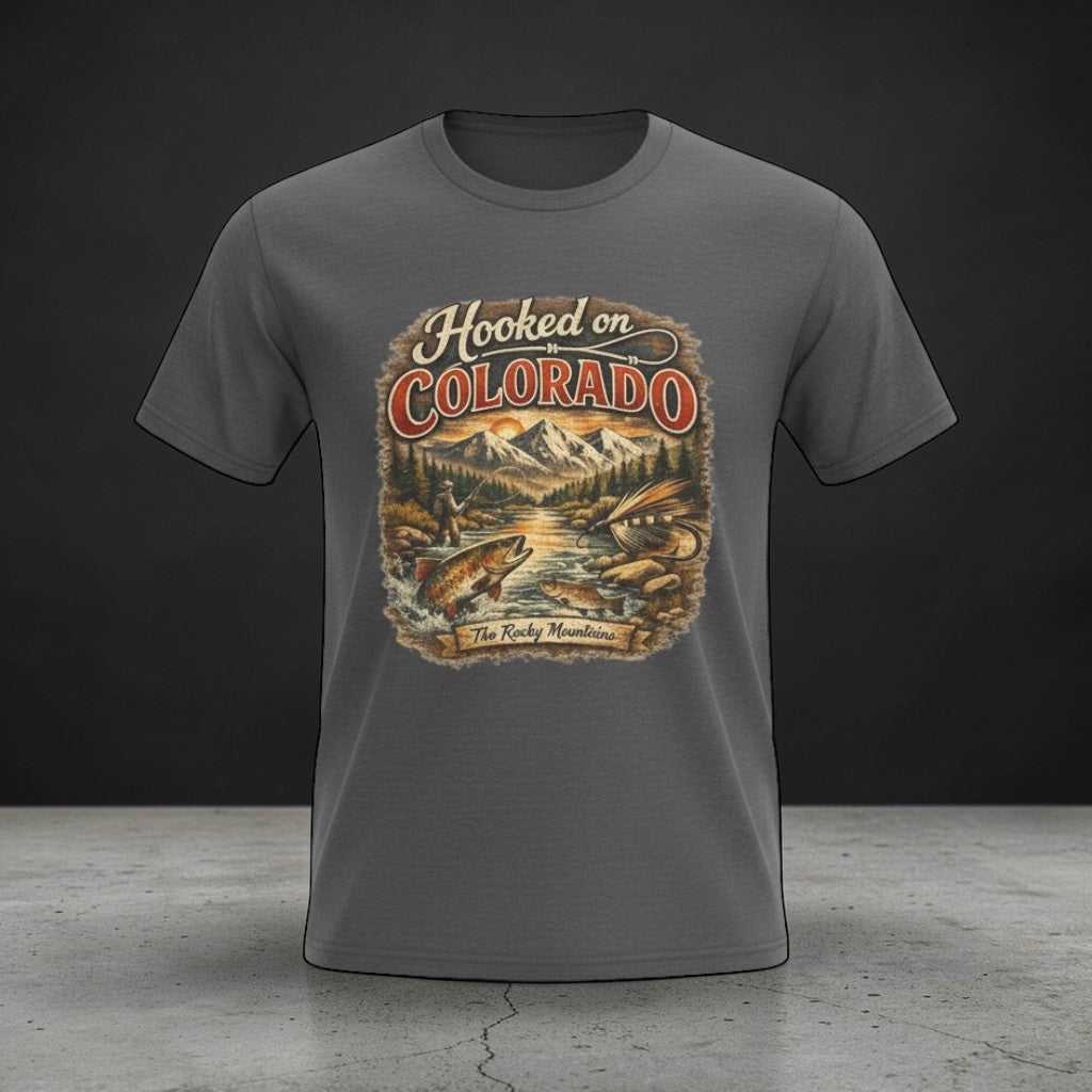 Big Sky Ranch Co. Hooked on Colorado Fishing T-Shirt with retro mountain trout graphic, showcasing a colorful fishing scene on soft cotton.
