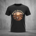 Western Sunset Tee by Big Sky Ranch Co. featuring a desert scene with a sunset and the phrase "Where the West Still Lives" on a T-shirt.