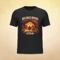 Red Rock Riders Utah vintage motorcycle sunset graphic T-shirt by Big Sky Ranch Co. displayed with bold red color and detailed design.
